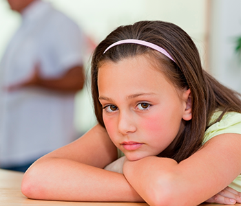 A girl sitting on a table